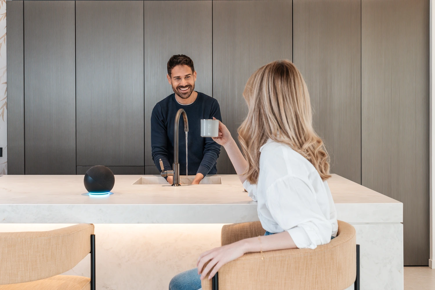 Couple chatting in the kitchen